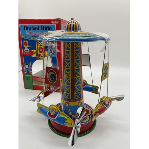 Vintage new tin toy schylling rocket ride carousel